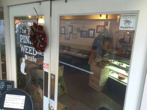 Happy Cow sticker at The PINK WEED Cafe in Kobe