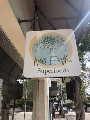Sign as seen from sidewalk at New Earth Health Cafe in Grover Beach