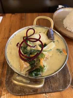 Green curry with tofu served with a rice pyramid  at IMM Thai Kitchen  in Toronto