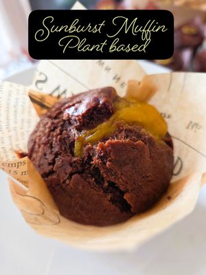 A luscious plant-based cocoa muffin with a tangy-sweet orange jam centre — crafted for a flavourful duet. at Botanic Bake in North Singapore