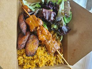 Sampler plate: Arroz con gandules,BBQ CHN Pincho, side salad and maduros at Casa Borinqueña in Philadelphia