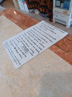 Sign about strong smells at Kitten Company in Kyoto