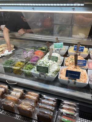  The ones with the green signs are the three vegan cream cheeses.  at Broad Nosh - Ninth Ave in New York City