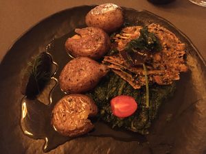 Tofu à la lagareiro, with seaweed, spinach and potatoes at Em Carne Viva in Porto