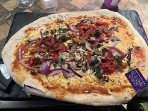 Geneva pizza with meat removed and vegan cheese added   at The Bulls Head East Leake in England