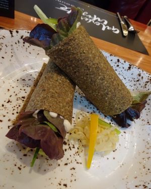 ONION WRAPS/HARISSA/VEGAN MAYO/SAUERCRAUT  at Super Natural Kitchen in Dubai