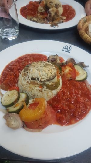 Main dish with grilled veggies and tomatoes at Al Dar Syrian Restaurant in Hannover