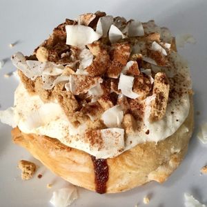 Coconut Cookie Roll - Vanilla frosting Graham Cracker Cookies, Coconut, and Cinnamon Sugar at Cinnaholic in New York City