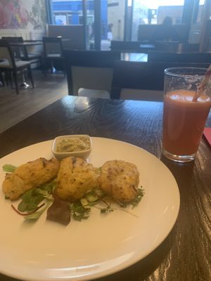 Polenta and cauliflower bakes and a ginger, carrot, and apple juice   at 222 Vegan Cuisine in West London