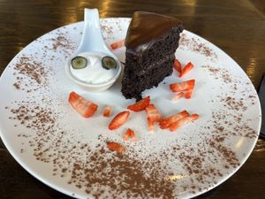 Chocolate gâteau with coconut whipped cream  at 222 Vegan Cuisine in West London