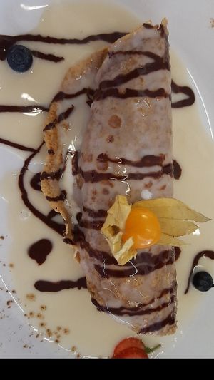 Lovely wholemeal pancake with ice cream and vanilla and chocolate sauce, yum :) at 222 Vegan Cuisine in West London