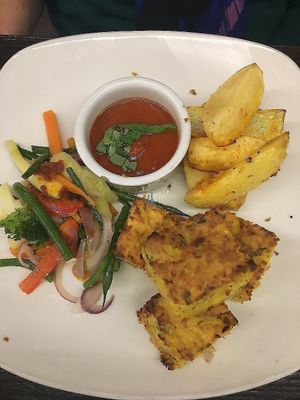 Sweet corn tart with mixed veges, roasted potatoes and tomatoe sauce for dipping at 222 Vegan Cuisine in West London