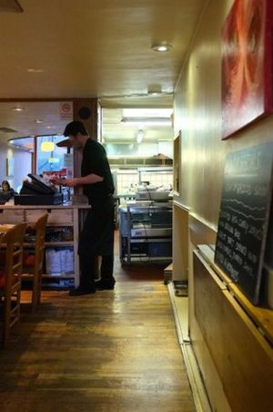 The restaurant and in front the kitchen, a very big one. at 222 Vegan Cuisine in West London