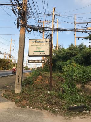 Road signs  at Santosa Vegan Restaurant in Phuket