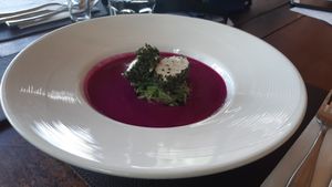 Dragon fruit gazpacho with 'cheese'. Raw and gluten free. at Santosa Vegan Restaurant in Phuket
