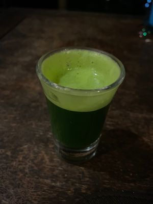 Wheatgrass shot at Santosa Vegan Restaurant in Phuket