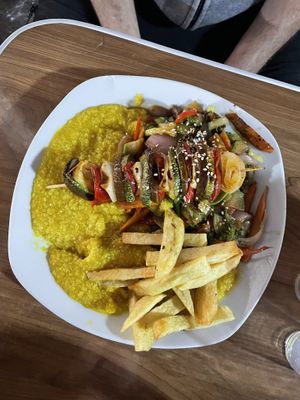 Pumpkin quinoa risotto with vegetable skewer & fries  at Vegan Point in Cusco