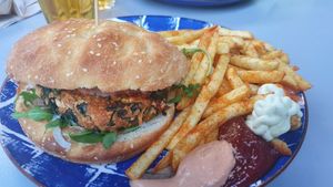 Tofu burger, fries and vegan sauces at Gartenbeiz zum Gaul in Zurich