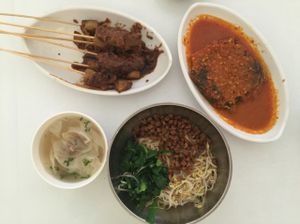 mi Pangsit- great noodles+ dumplings that is not spicy. Assam chilli fish had a weird taste - tastes like tofu but more processed taste. satay is fantastic  at Loving Hut in Denpasar