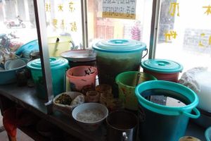 In addition to the back kitchen where they cook the noodles, they have a front kitchen where they finalize your dish by adding various sauces, herbs and other ingredients. at Wenjun in Jianshui