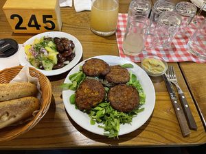  Lentil burgers on a salad bed, salads at Weingut Feuerwehr Wagner in Vienna