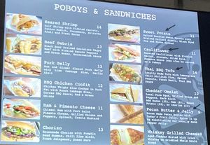 Wall menu (I highlighted vegan items with arrows here) at Killer Poboys in New Orleans