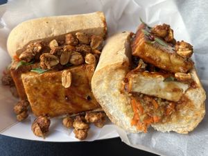 Thai BBQ Tofu- Locally Made Tofu Marinated in a Thai BBQ Sauce served with Lemongrass and Thai Chili Mirliton Slaw, Spiced Peanuts and Coconut  at Killer Poboys in New Orleans