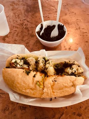 Roasted cauliflower poboy and mustard greens at Killer Poboys in New Orleans