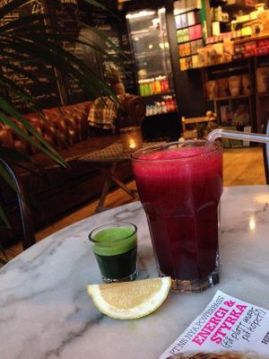 'Beet me' juice (beet root, ginger, celery etc) and a wheat grass shot at Fruits and Friends Juicebar in Boras