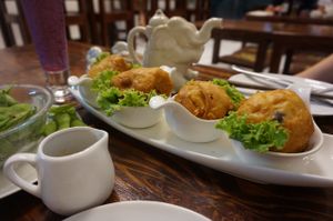 Fried doughy balls with salted edamame on the side at Mango in Bangkok