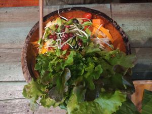 Som Tum (cold Green papaya salad) with fruit and veggies. The spicy sauce was on bottom so that was a surprise. at Mango in Bangkok