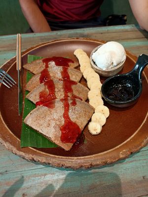 Pancakes with fruit and vanilla ice cream at Mango in Bangkok