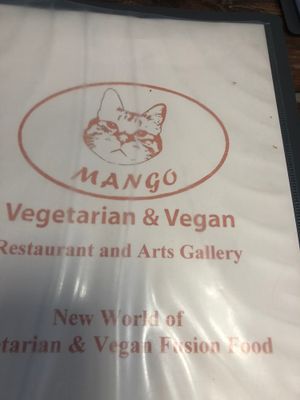 The menu cover which includes a drawing of a cat since there are plenty of cats lounging around inside at Mango in Bangkok