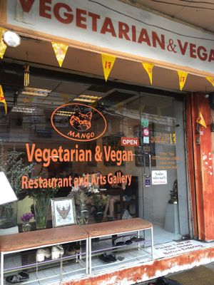 Exterior shot with cute artwork on the walls  at Mango in Bangkok