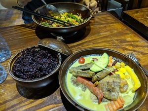 Banana green curry, black rice, and Kung Pao zoodles... Amazing flavors! at Mango in Bangkok
