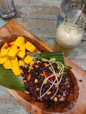 Black rice with mango and a kombucha mocktail. at Mango in Bangkok