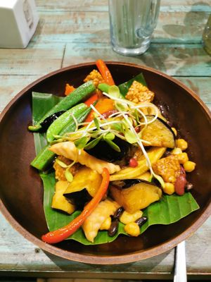 Stir fried tempeh eggplants okras peppers chick pea at Mango in Bangkok