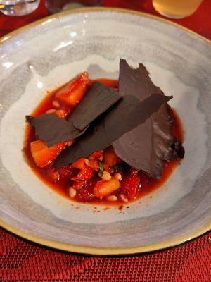 Dessert - pine nuts and strawberries in a syrup with spicy pepper and home-made dark chocolate flakes at So Dream in La Rochelle