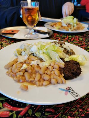 Burger, cannellini, artichoke salad and creamy lentils at Kamilou in Brussels