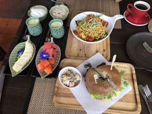 Breakfast, coconut yogurt, fruit, bagels, scrambled tofu, fresh juice and coffee😋  at Green Tiger House in Chiang Mai