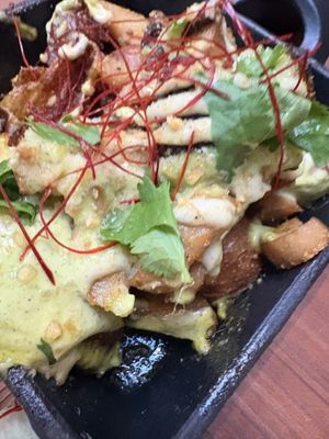 Loaded potatoes!!! Our favorite dish!! My mom would be so mad at me for filling up on potatoes at a fancy restaurant but WORTH IT  at Tane Vegan Izakaya - Highland Park in Los Angeles
