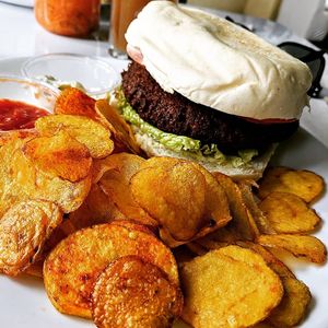Burger and potato slices at Herbívoro -  Av. Suba in Bogota