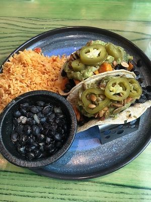 Sweet potato tacos on soft corn shells.  Ask for no cheese, and sub the refried beans to black beans.  Delicious and filling! at Gorilla Taco in Pigeon Forge