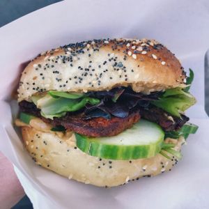 Asian bagel, watching her cut all the veggie fresh! Super yummy  at Inez Bagel Shop in Budapest