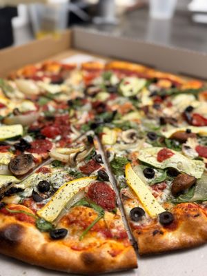 Vegan Veggie Edition - 
Vegan cheese, mushrooms, olives, red peppers, onions, spinach, shaved zucchini and squash (All vegan products are soy free) at On The Run Pizza - Ghost Kitchen in Las Vegas
