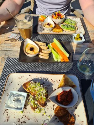 Breakfast. I had "Mallorca" and my partner had "Continental". Ordered extra hummus. at Villa Vegana in Mallorca