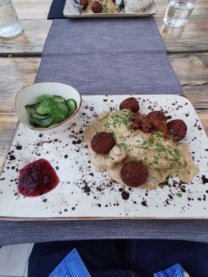 Main course: Kötbullar: Vegan meatballs with
creamy mushroom marsala sauce, served with mashed potatoes, cucumber salad and lingonberry yam at Villa Vegana in Mallorca