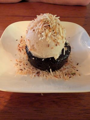 Flour less chocolate cake with vanilla ice creme and toasted coconut at aíso in San Francisco