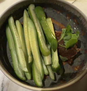 I ordered the cucumbers specifically for the soybean paste that came along side them.. strong miso type pastes were common when I lived in Korea and I totally miss it.   Delicious! at Whisky & Ramen in Anchorage