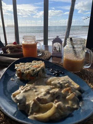 Tofu steak with Mushroom sauce and vegetable rice; seitan burger, fresh juices  at Raízes - Cozinha Saudável & Vegetariana in Quarteira
